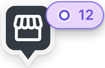 A dark marker with a store icon paired with a purple count badge, representing assets dwelling at a known location
